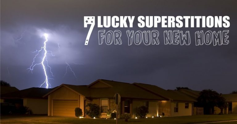 House at night during thunderstorm, overlaid with text that reads 7 Lucky Superstitions for Your New Home.