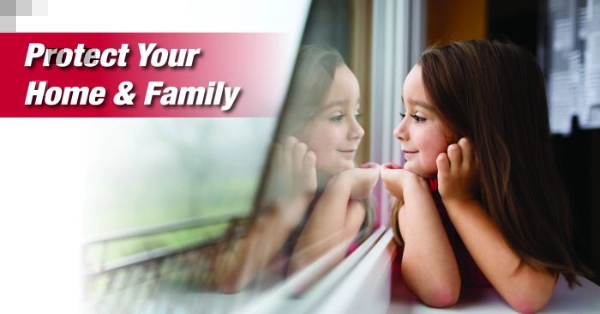 A little girl looking out a tinted window with text that reads Protect Your Home and Family.