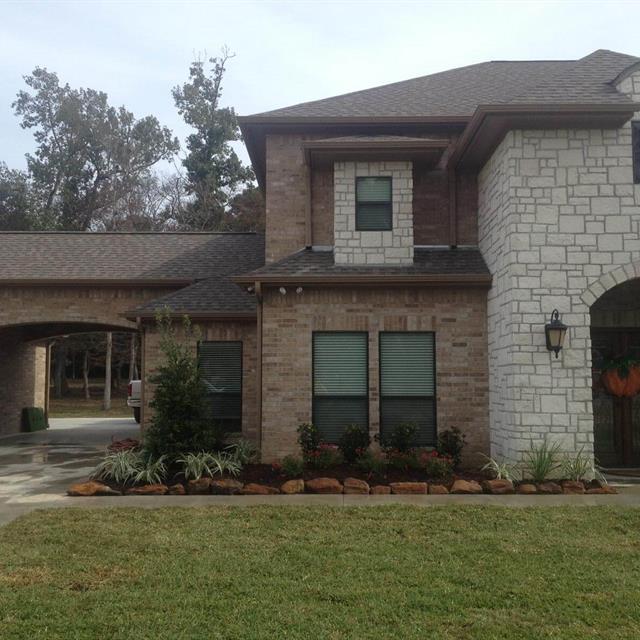 A Beautiful house with grass yards and gardens