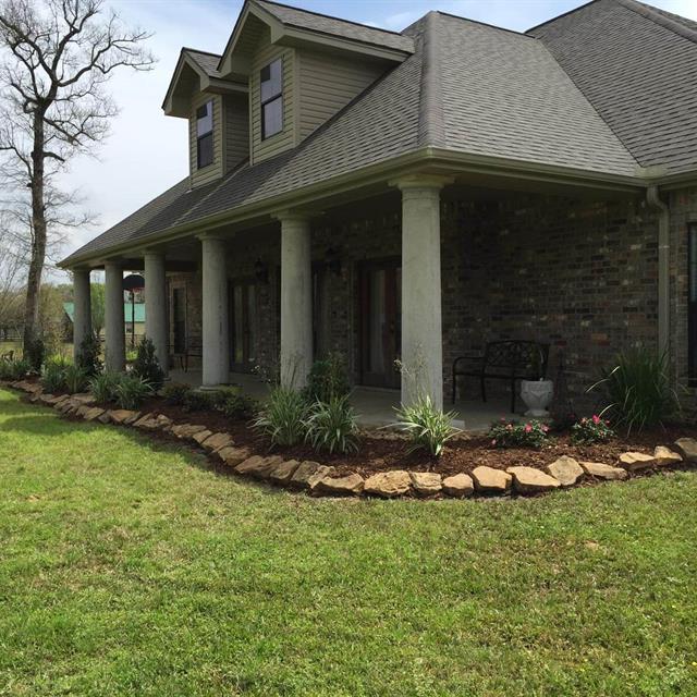 A beautiful house with a lawn and gardens