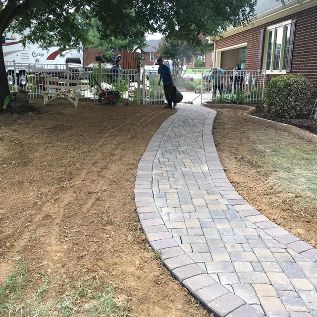 A completed stone pathway in a gardening work.