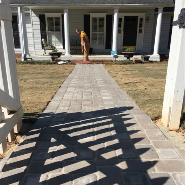 A man cleaning his lawn