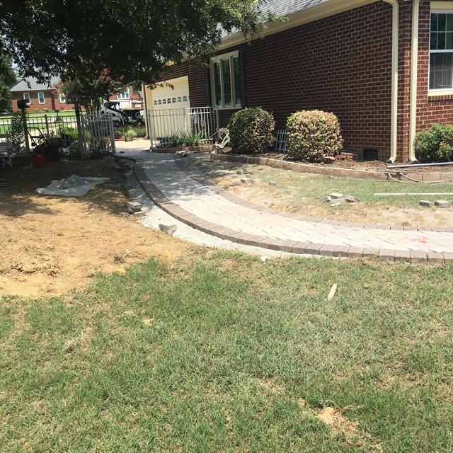 A stone pathway near a patio.