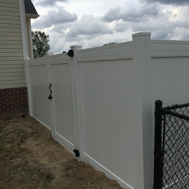 A wooden fence painted white.
