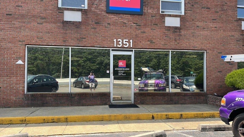 Reflective film installation to provide privacy during day time hours and high level of heat and light rejection