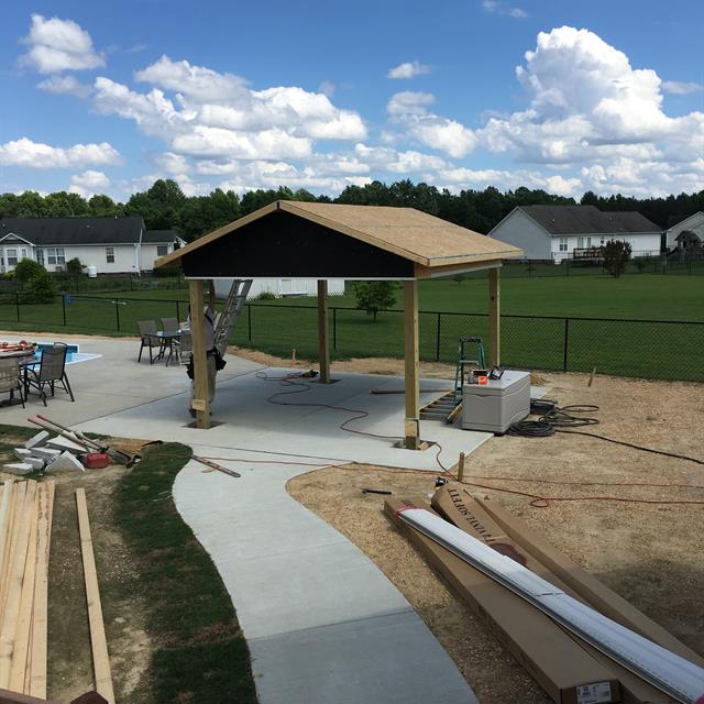 Construction is underway near a pool.