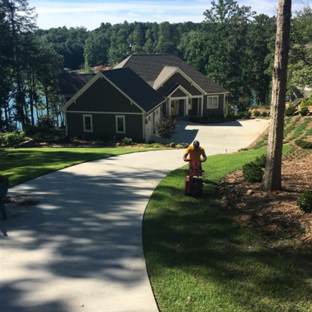 Employee cleaning the lawn