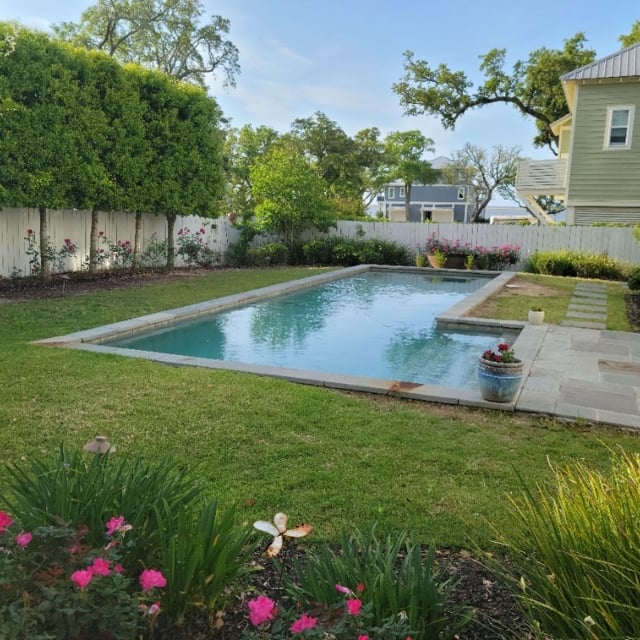 Flower beds along backyard fence