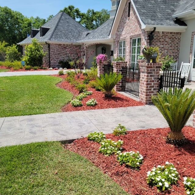 Flower beds with red mulch