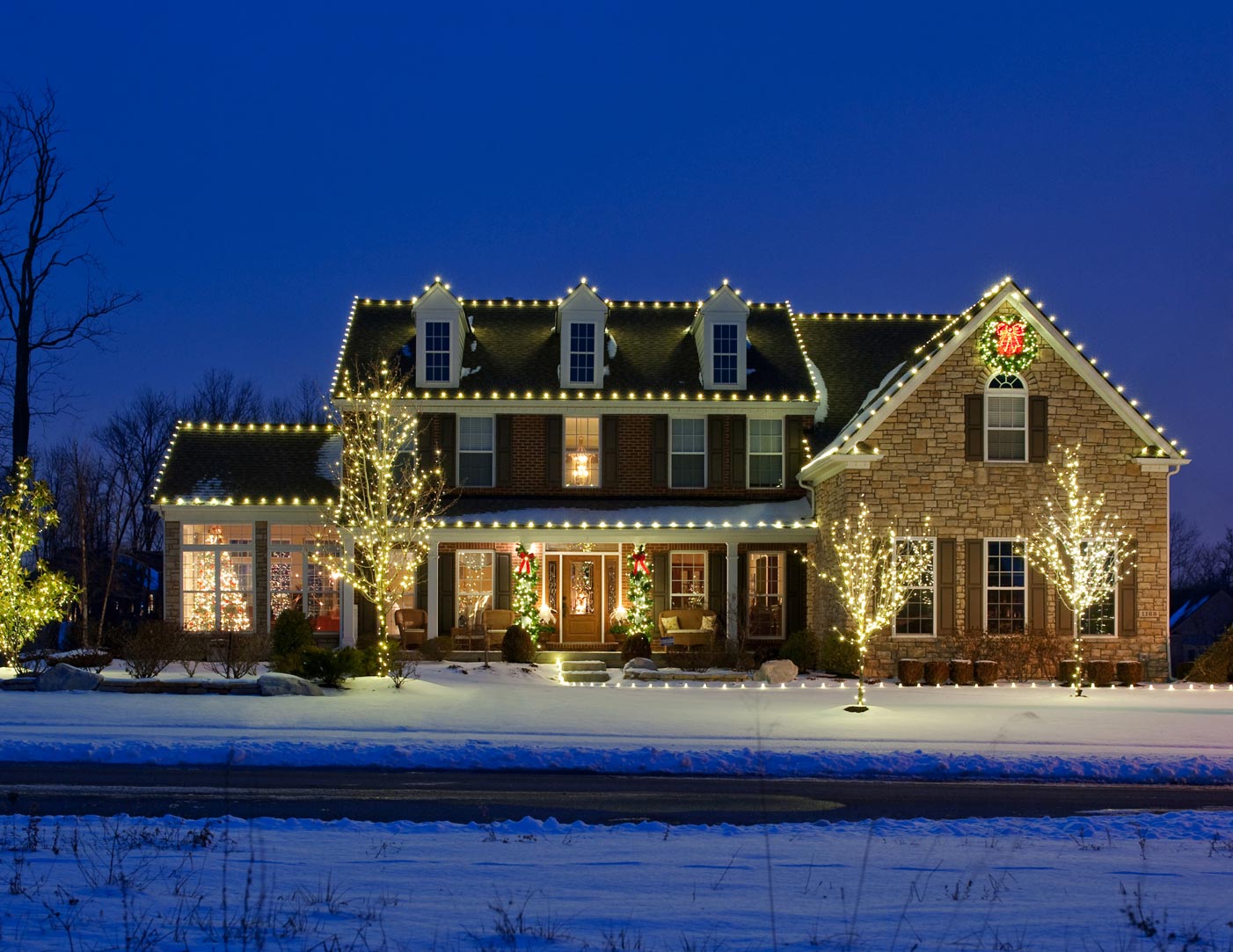 Front of house with holiday lighting
