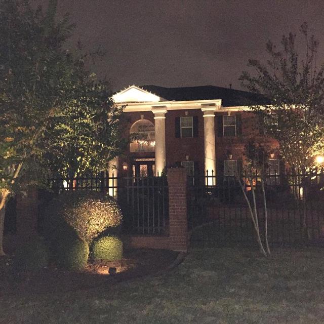 Front of house with night lighting