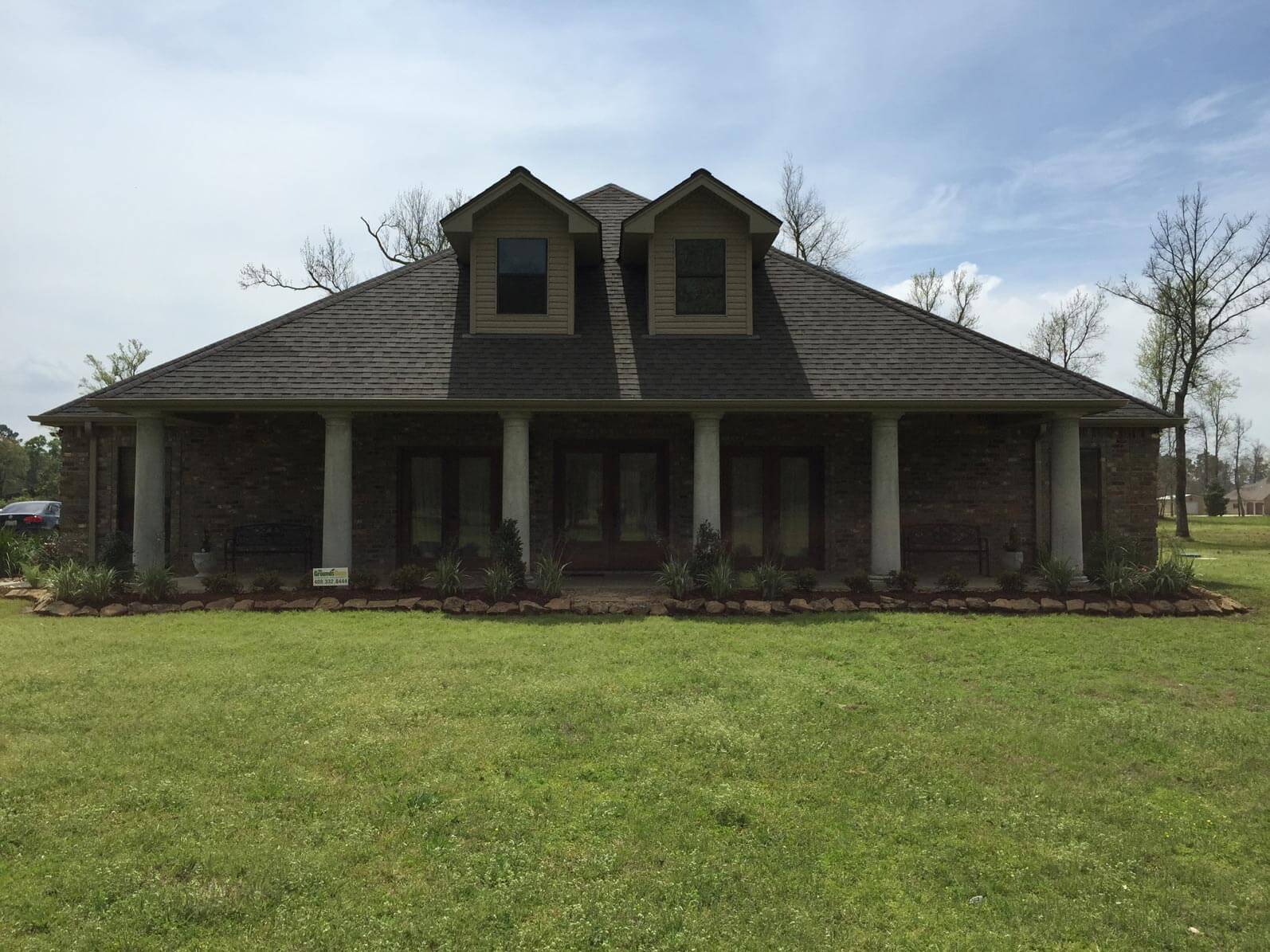 Grass landscape in front of house