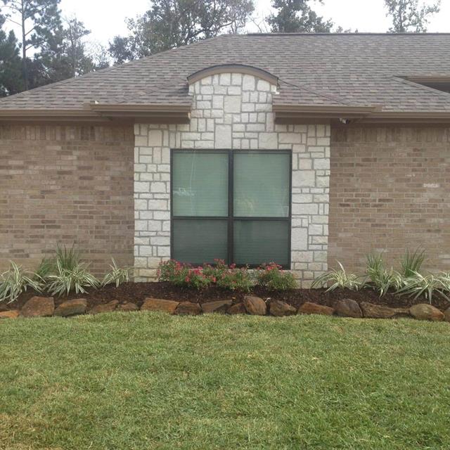 Grass yard in front of the house