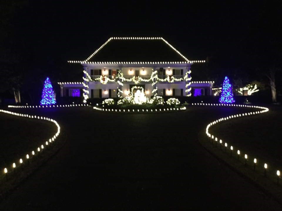 Holiday lighting on two story house