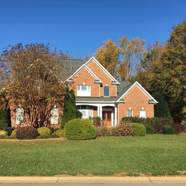 Home with a beautiful garden in front