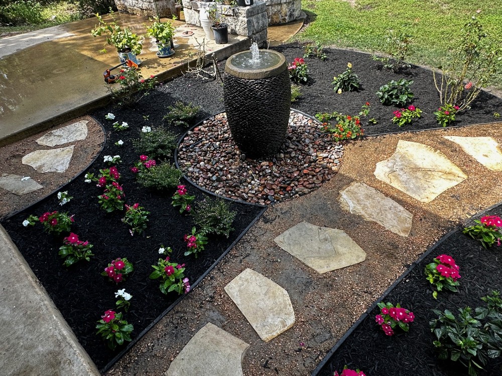 Landscaping, fountain, and flagstone/crushed granite path