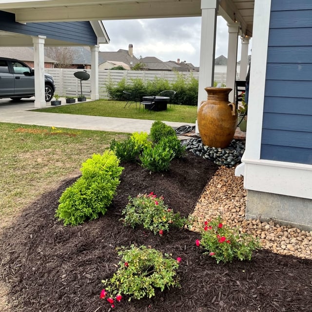 Landscaped front yard with walkway and garden