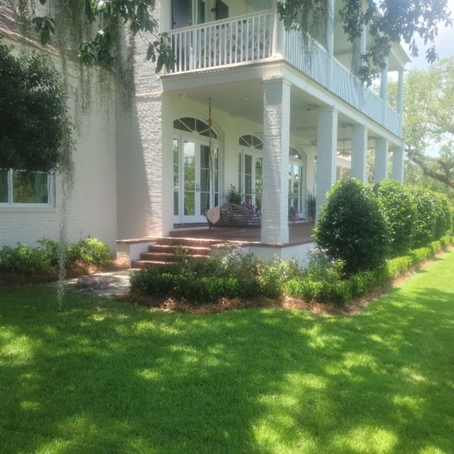 Landscaping around large front-yard porch