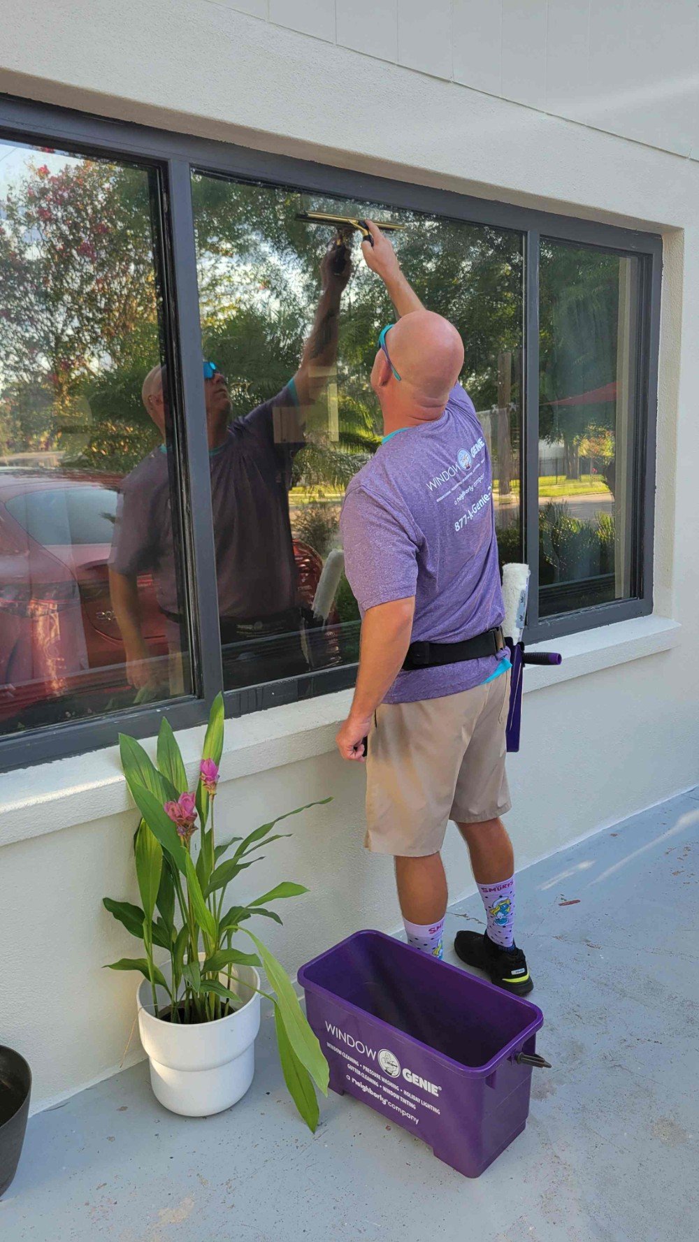 Service professional cleaning window