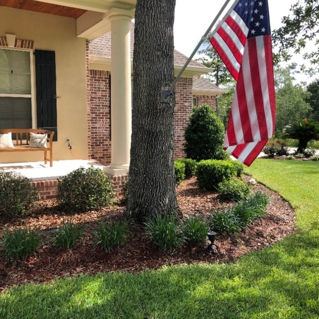 Shrubs lining front porch