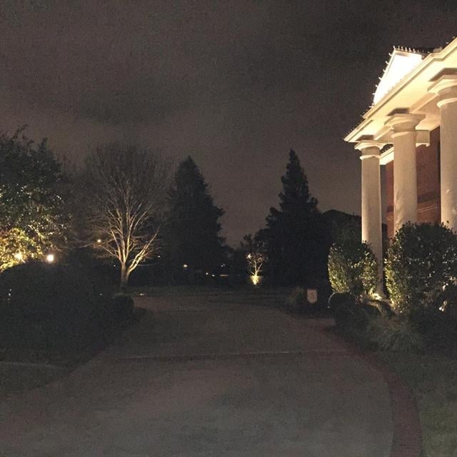 Side view of front of house with night lighting