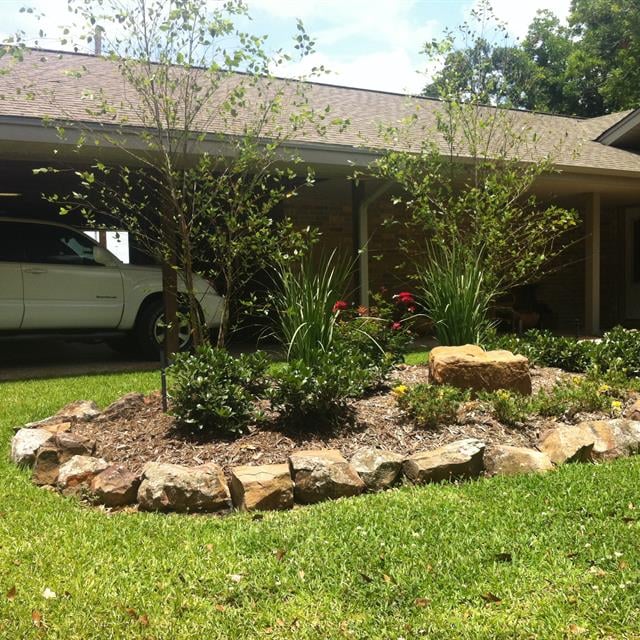 Soil and stone landscape view in front of a house