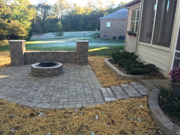 Stone patio with fire pit. 