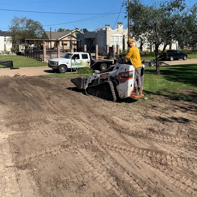 The Ground Guy leveling the plot for landscaping