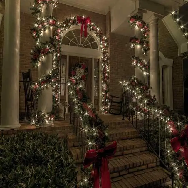 holiday lights on a front porch at night
