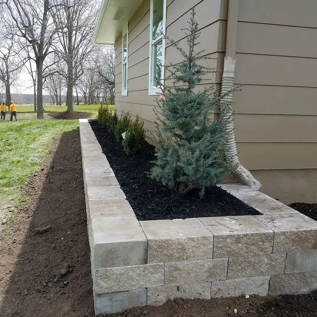 raised flower bed at the side of a house