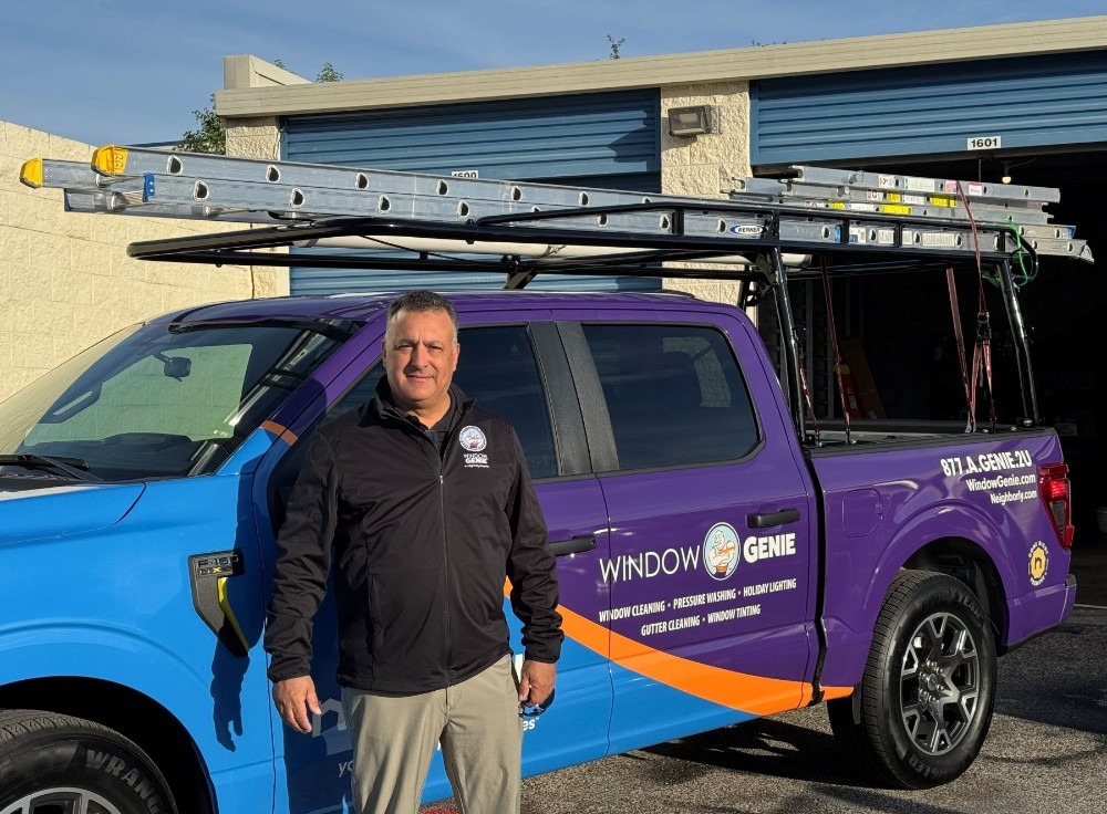 Picture of Window Genie Owner Nelson Russo standing in front of branded fleet truck #1