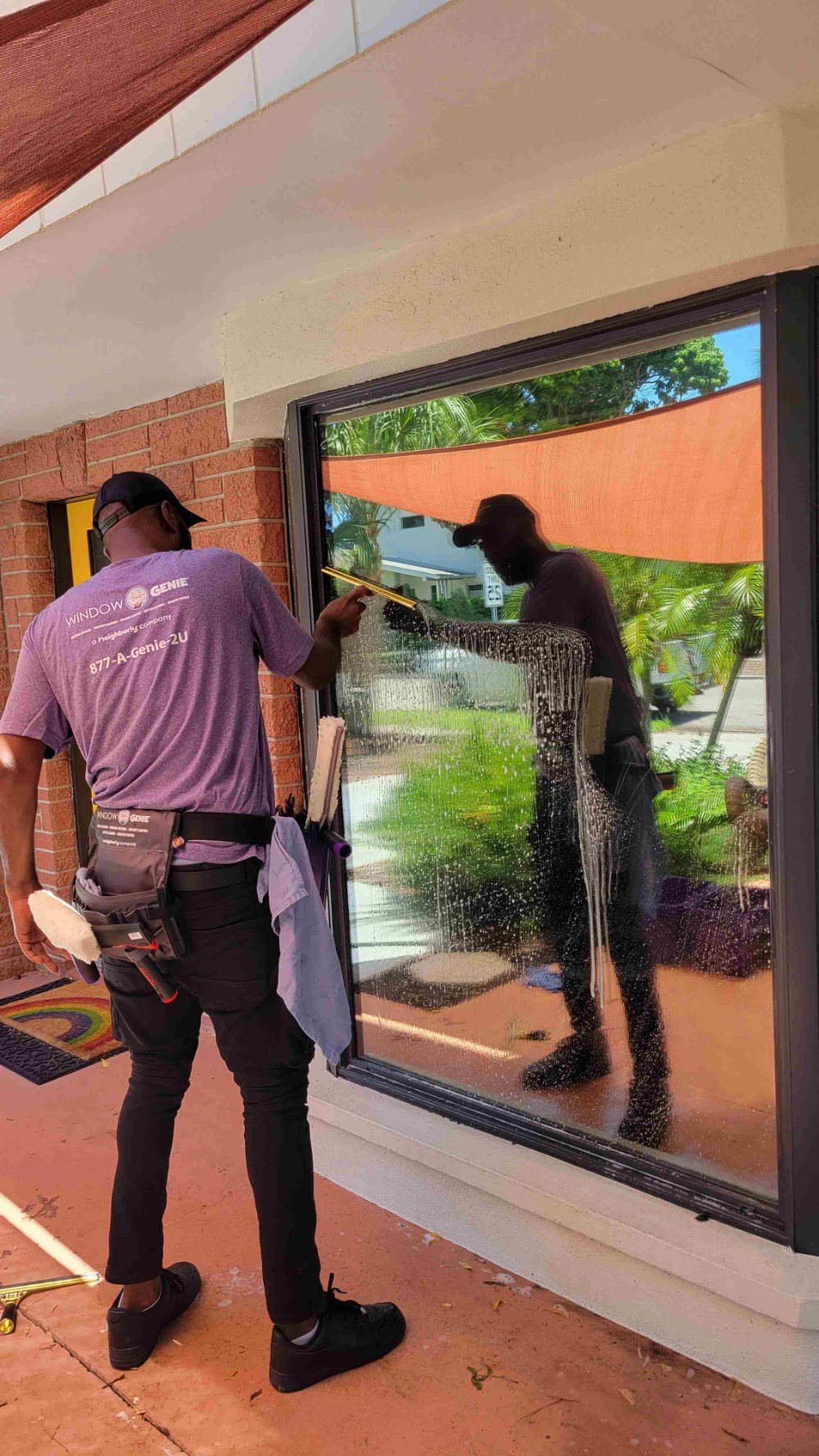 Window cleaning professional using Figure S method