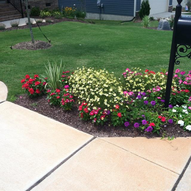 front lawn landscape with flower beds
