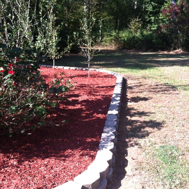 side view of the new garden with a stone border