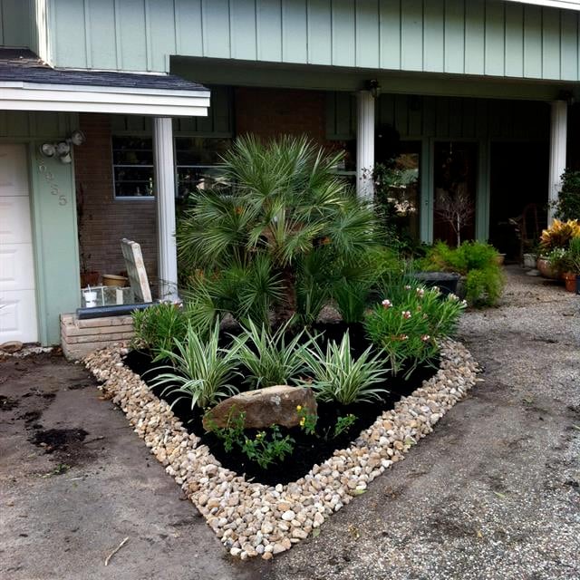 stone and soil landscape in front of House