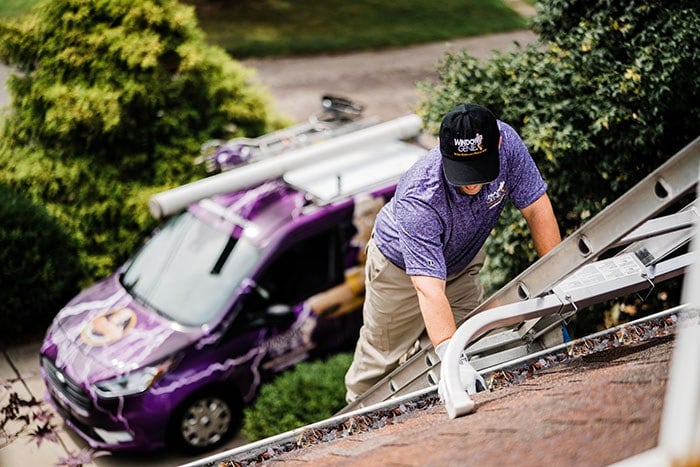  Window Genie tech providing gutter protection service