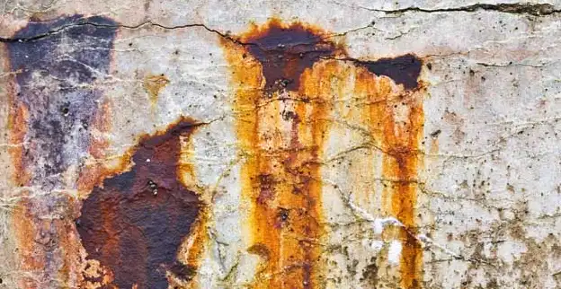 Rust stains on a concrete wall.