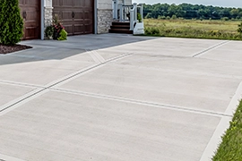 A recently pressure-washed concrete driveway.