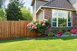 A single-family home with a wood fence.