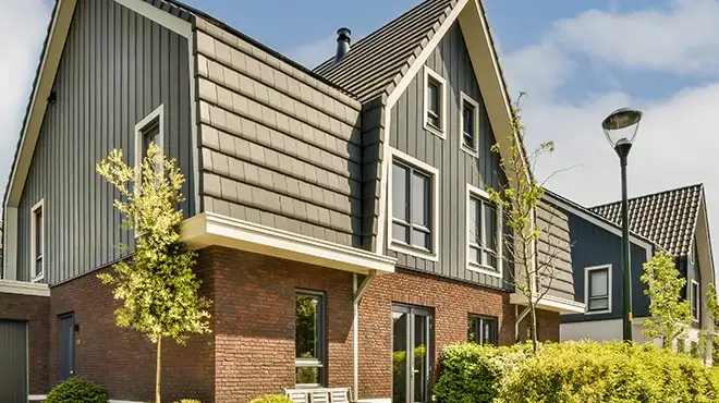 A townhome using various exterior materials like brick and siding.