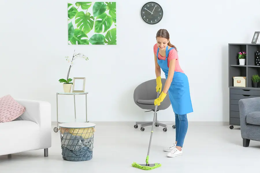 A women cleaning the floor.