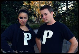 A couple wearing Black-eyed P t-shirt.