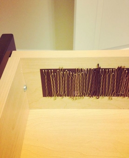 A shelf filled with various hair ties in different colors and styles.