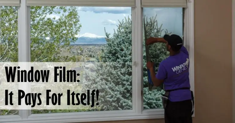 A professional applying insulating window film