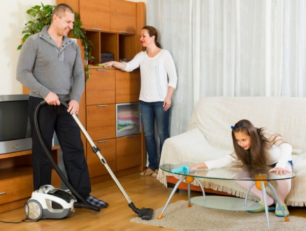a family cleaning the house.